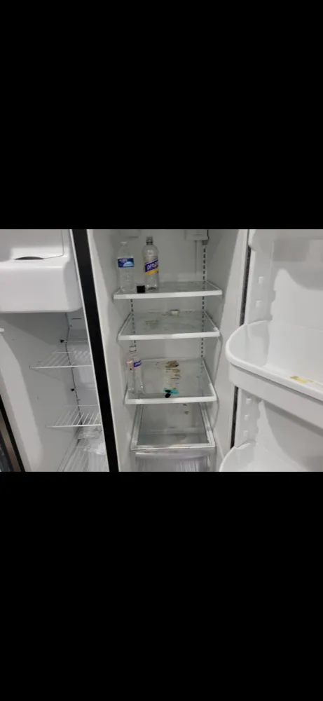 The inside of a refrigerator before a move-in clean